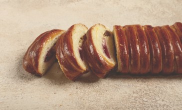 Sweet braided roll, stuffed with jam and raisins, pastries, sweet bread with filling, sweet pie, no