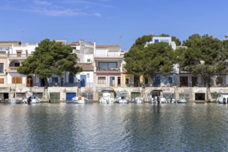 Portocolom fishing village on Majorca with boats and colourful houses Holiday by the sea in