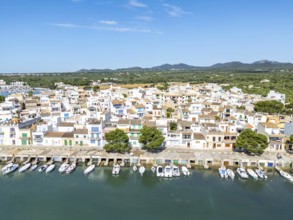 Portocolom fishing village on Majorca aerial view from above with boats holiday by the sea trip in