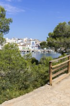 Portocolom fishing village on Majorca with boats and colourful houses Holiday by the sea in