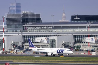 An Embraer 190 aircraft of LOT Polish Airlines with the registration number SP-LME at the airport