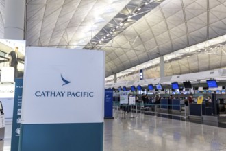 Cathay Pacific check-in counter in the terminal at Chek Lap Kok Airport (HKG) in Hong Kong, China