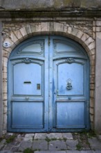 Old, weathered Tor tor, portal, light blue, old town, Bayeux, Normandy, Calvados, France