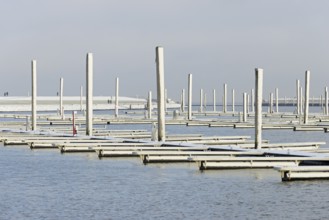 Winter day, onset of winter, snow on the jetties in the marina, North Sea, Norddeich, Lower Saxony,