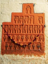 Sati stone hands mark the site of a woman's self-immolation at Mehrangarh or Meherangarh Fort,