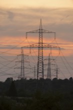 Sunset with numerous electricity pylons and a calm, dramatic atmosphere, Waiblingen,