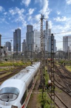Bridge at Camberger Straße, Galluswarte, Deutsche Bahn, tracks and trains with the skyline of