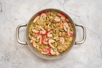 Overhead view of pan with tender shrimp, octopus and mussels with leek