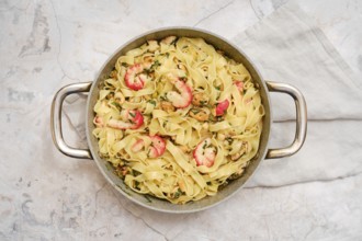 Delicious fettuccine allo Scoglio presented in a rustic bowl, showcasing succulent seafood and