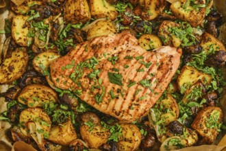 Juicy roasted turkey breast is perfectly cooked and garnished with fresh herbs, surrounded by