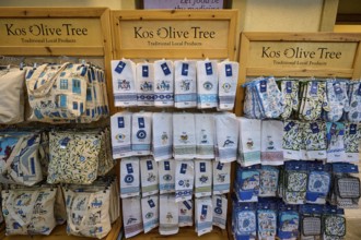 Ifestou alley, shelves with souvenir towels, decorated with local patterns and designs, Kos town,