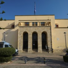 Archaeological Museum, Strict building with stone staircase and Greek flag, Kos Town, Kos,