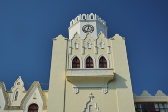 Palace of Justice, colonial building, close-up of a white clock tower with gothic arches against a