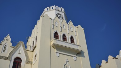 Palace of Justice, colonial building, Gothic-style bell tower with clock and battlements under a