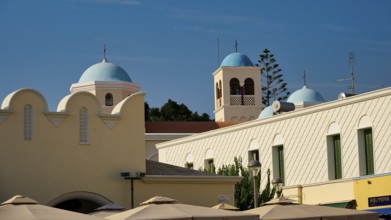Church, Panagia Agia Paraskevi, domed buildings under a blue sky with traditional architectural