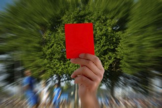 (Photomontage) Red card at a football match
