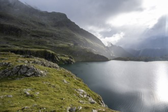 Wangenitzseehütte and mountain lake Wangenitzsee, cloudy mountain peaks in the morning, Schober