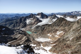 View of mountain basin with blue glacier lakes, behind summit Becher with Becherhaus, glacier