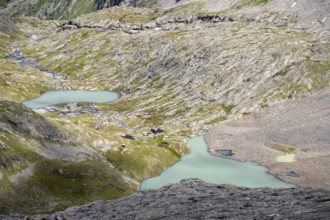 View of turquoise-blue mountain lake Großer Gradensee, Schober group, Hohe Tauern National Park,