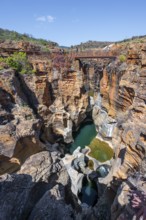 Bridges over a canyon with steep orange-coloured cliffs and the Blyde River, Bourke's Luck