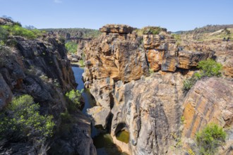 Bridges over a canyon with steep orange-coloured cliffs and the Blyde River, Bourke's Luck