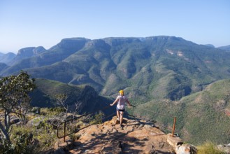 Tourist at the viewpoint, view of the Blyde River gorge, Lowveld Viewpoint, in the evening light,