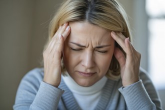 Close up of woman touching forehead in pain. Concept of headache or migraine discomfort. Generative