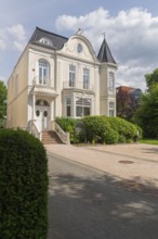 Living in the Schwachhausen district, façade of a Wilhelminian style villa with corner tower,