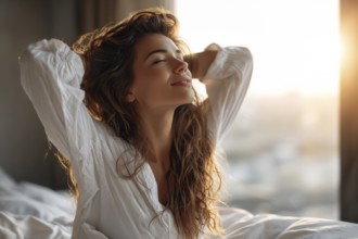 Beautiful Brunette is Waking up in the Morning, Stretches in the Bed, Sun Shines on Her From the