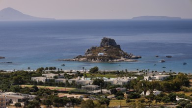 Panoramic view of an island in the sea and surrounding landscape with buildings, Agios Stefanos
