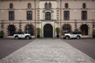 Black and white Renault Juvaquatre Editorial vintage cars in front of headquarters, head office,