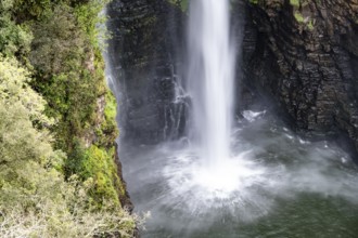 Water plunging into the depths, high waterfall in a canyon, Mac-Mac Falls, long exposure, near