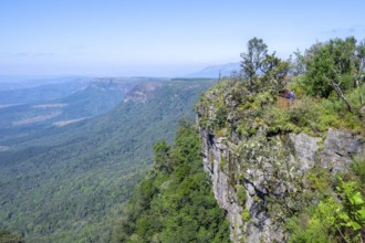 Tourist on a viewing platform at the canyon, view at God's Window, canyon landscape, near Graskop,