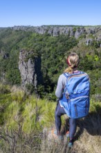 Young woman, view over densely forested canyon, Pinnacle Rock, near Graskop, Mpumalanga, South