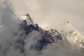 Small and large Bettelwurf with a thin layer of snow, behind wispy clouds, Small and large