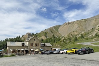 View of historic inn Refuge Napoleon on north ramp northern ascent downhill mountain road in front
