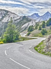 Photo with reduced dynamic saturation HDR of south ramp ascent of steep pass road with tight curves