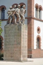 War memorial with four soldier figures and inscription, sculptures, text, Fruchthalle,