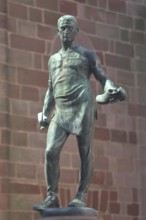 Cobbler's fountain with cobbler Johann Joß sculpture as a symbol of the former shoe industry and