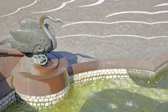 Castle fountain with swan figure with detail and reliefs by Gernot Rumpf 1984, water jet, bronze