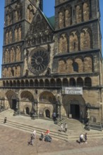 Gothic west façade of St Peter's Cathedral on the market square, double tower from 1896, rose