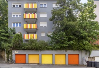 Apartment building in Werastrasse with colourfully painted balconies and garages. Stuttgart,