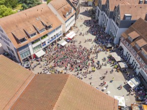 Aerial view of a large gathering on a market square in the old town centre, 950 years of Calw, Calw