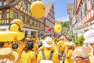 Colourful balloons above a crowd at a celebration, 950 years Calw, parade Calw, Black Forest,