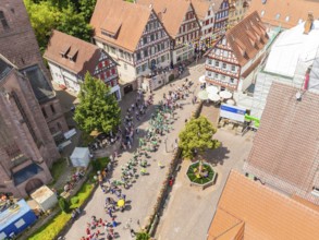 Aerial view of a street with historic houses and people enjoying a festival, 950 years of Calw,
