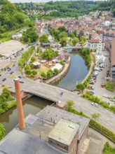 Aerial view of a cityscape with river, park and bridge in green surroundings, 950 years of Calw,
