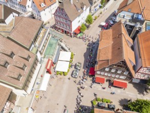 Historic buildings and crowds on a central town square, 950 years of Calw, Calw parade, Black