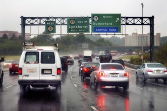 Rush hour on the motorway in the rain, New Jersey, USA