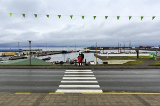 View of the harbour, fishing village at Skjalfandi Bay, rain clouds, Husavik, Húsavík, North