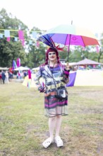 Artist with colourful umbrella at Kidzapalooza at the Lollapalooza Festival in the Olympiastadion